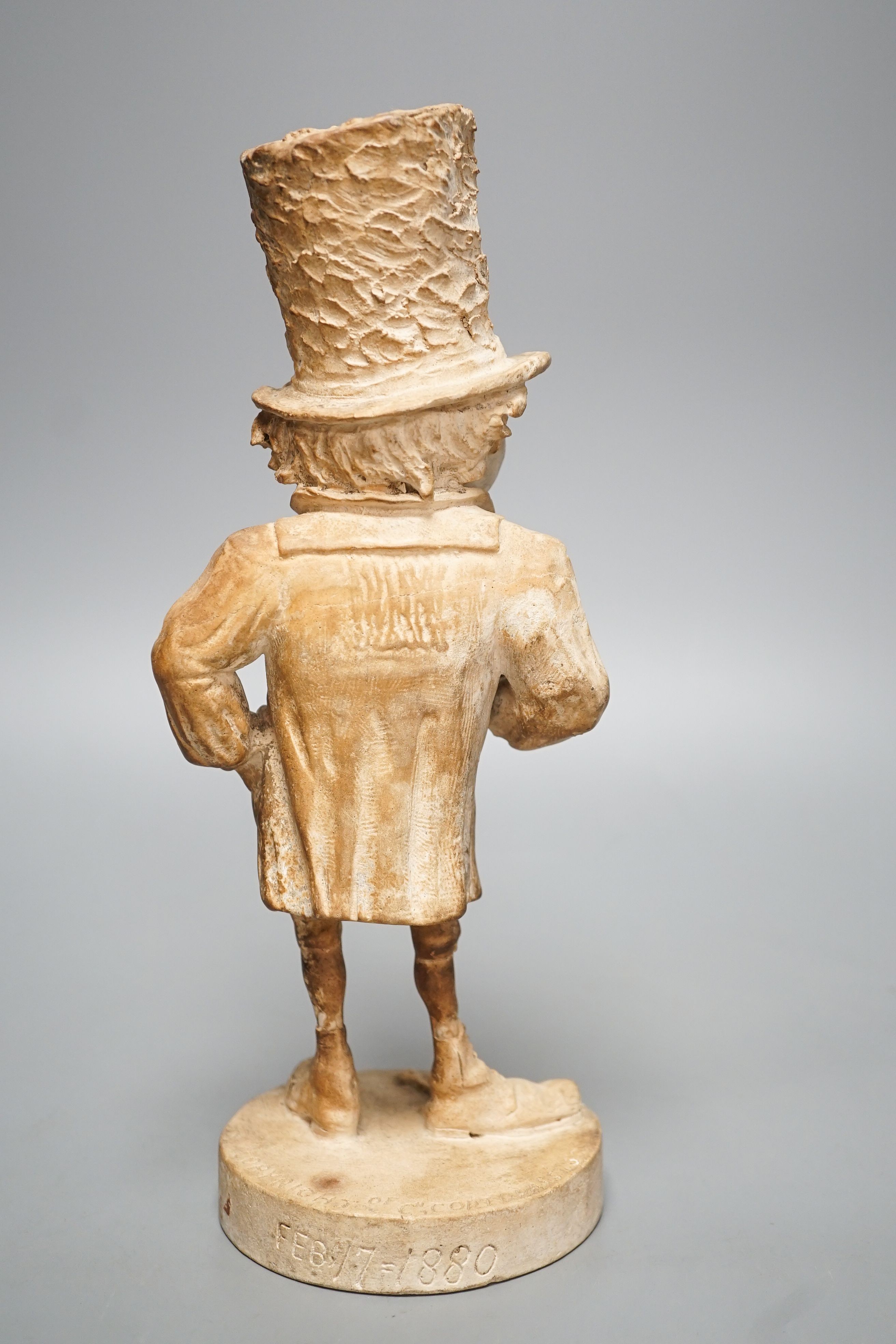 A plaster character figure, 'England, Feb 17 - 1880, Copyright of Ch, Cortopassi, Sc’ 27cm